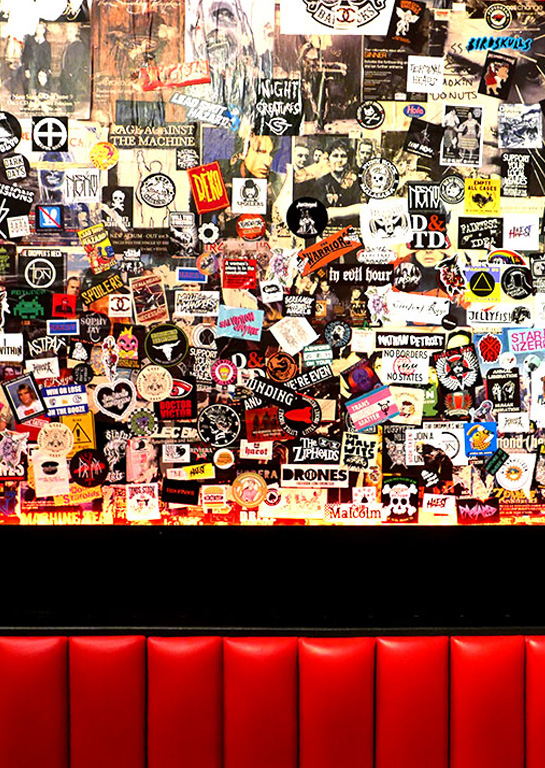 Photograph of a band sticker wall for website promo